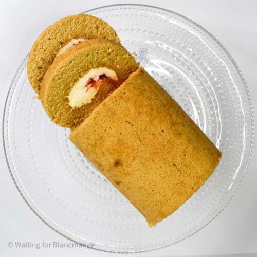 Cinnamon swiss roll cake with stabilized whipped cream filling and plum compote.