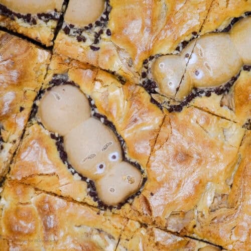 Overhead shot of white chocolate hazelnut blondies with Happy Hippos candy bars on top.