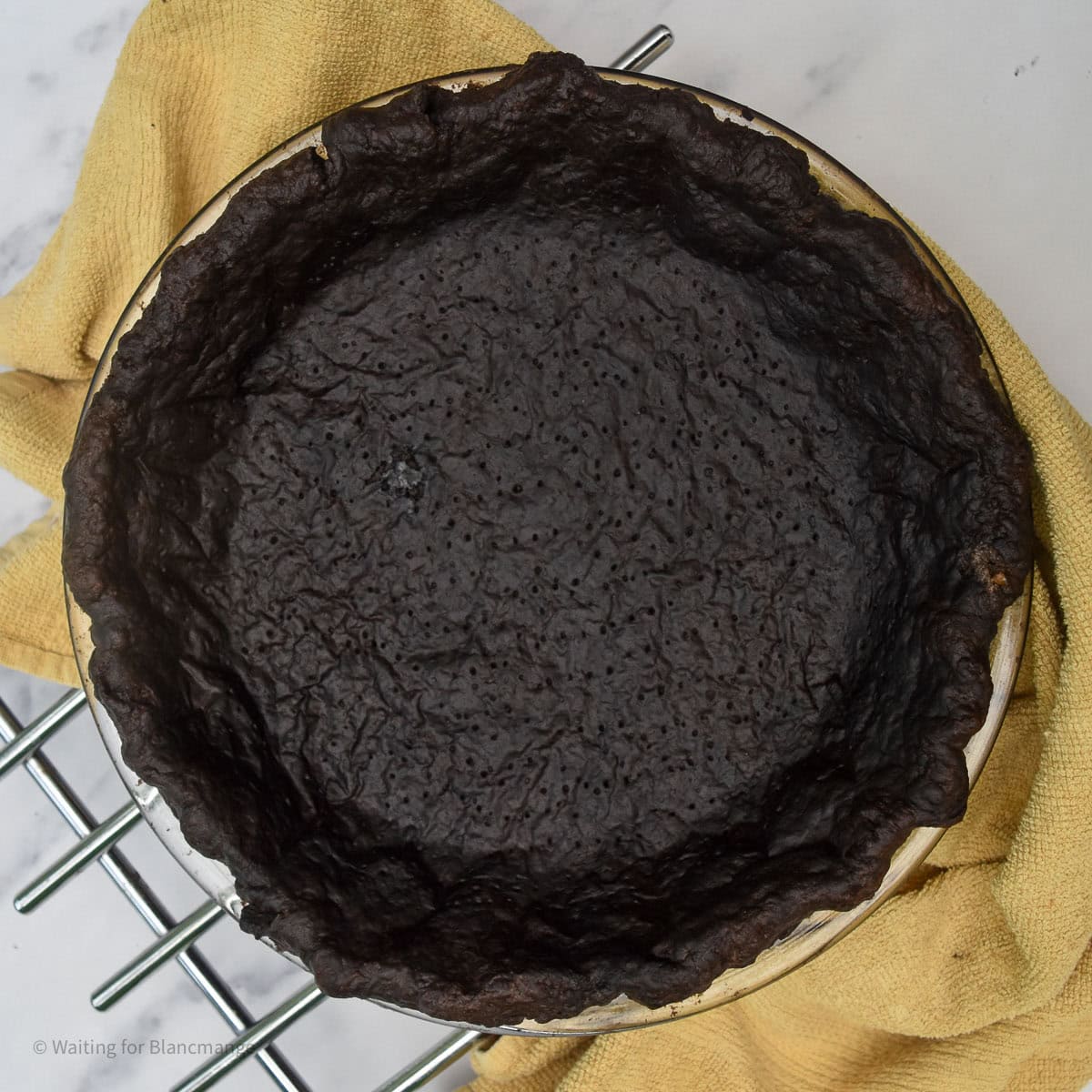 Overhead shot of blind baked chocolate pastry shell.